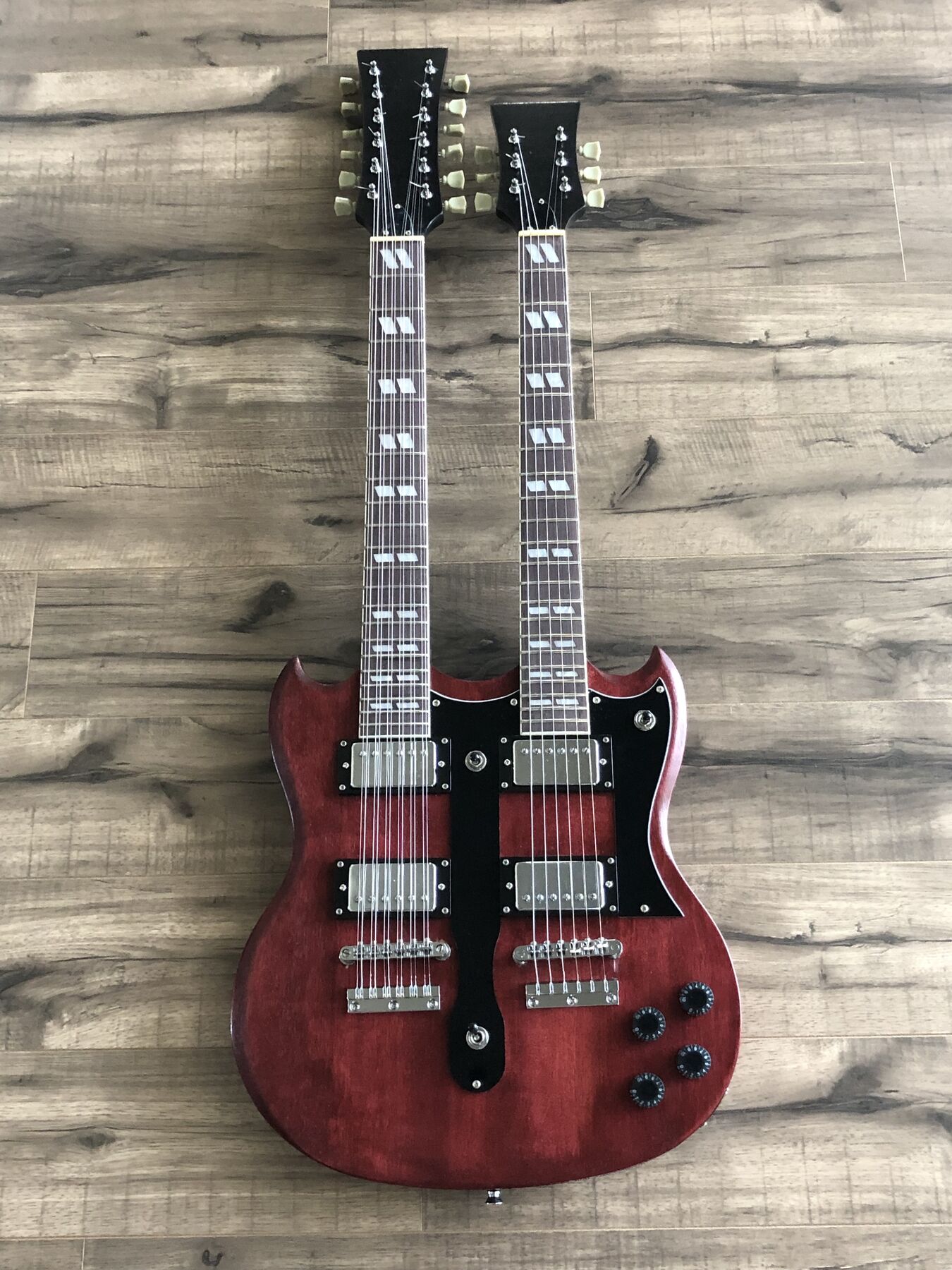 Cherry-red double-neck guitar with a twelve-string and a six-string neck
